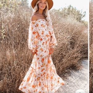 Never worn.  Vici Live for Sunsets Smocked Dress